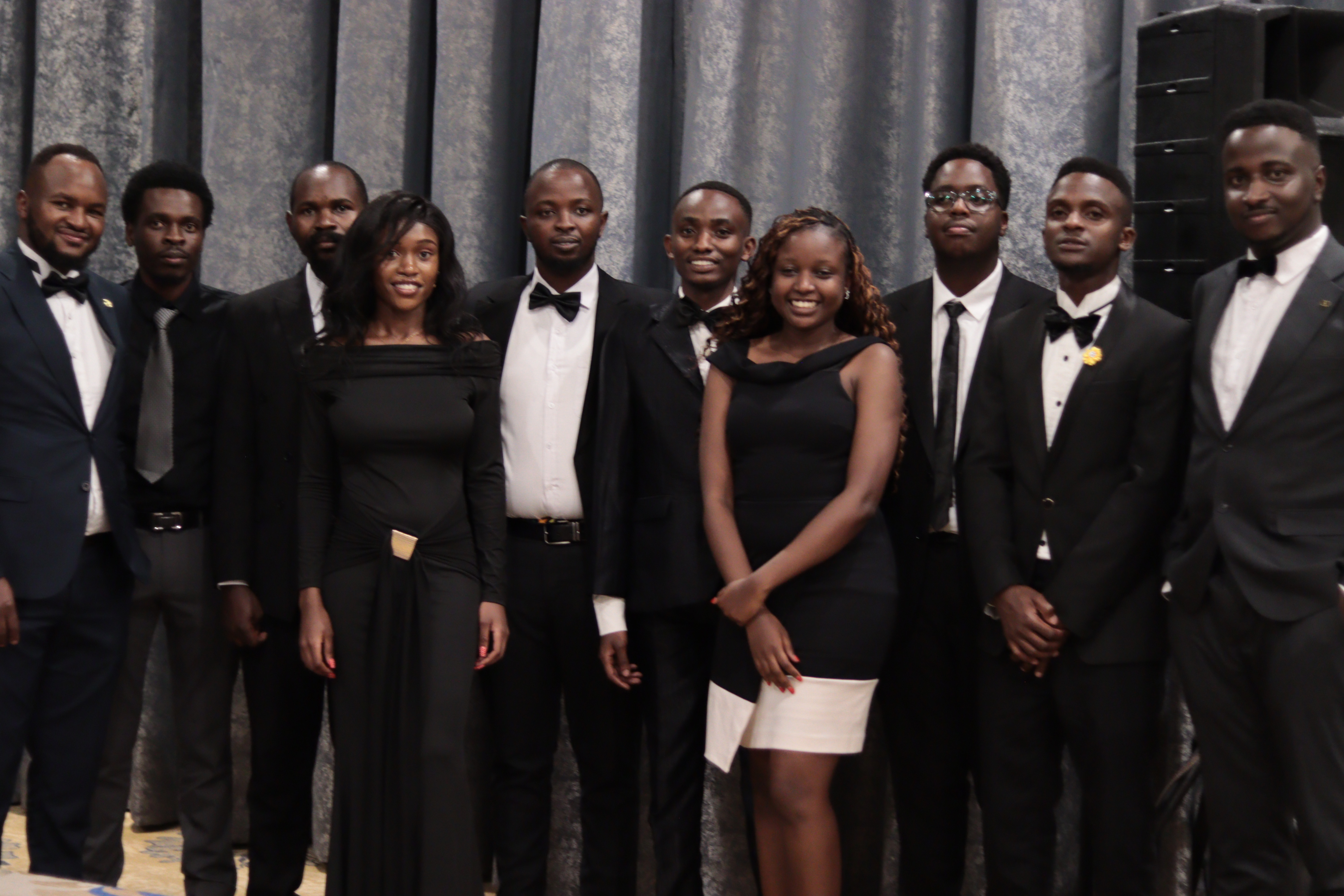 The Oleq team standing together at a company event